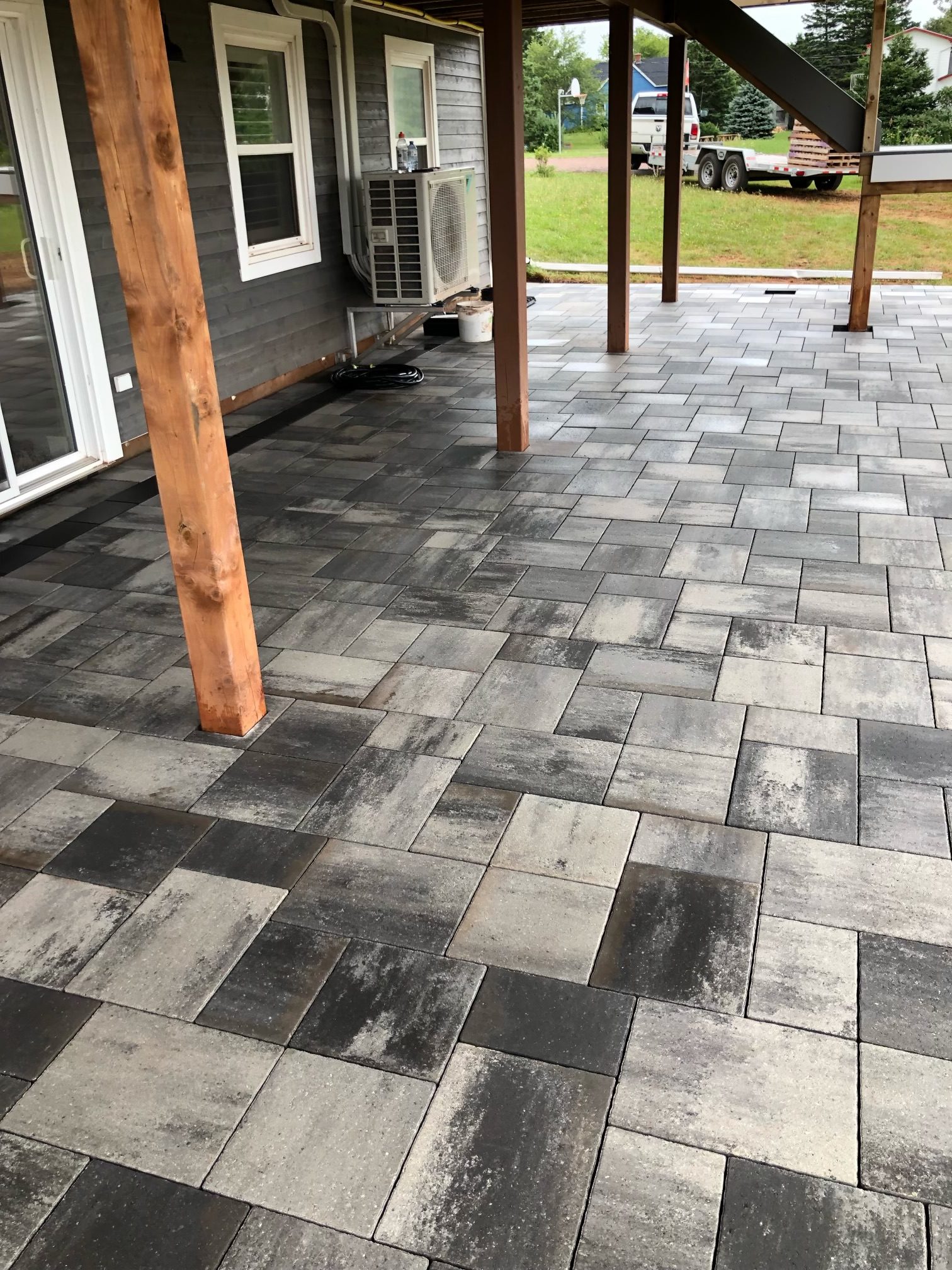Gray and black stone patio under porch