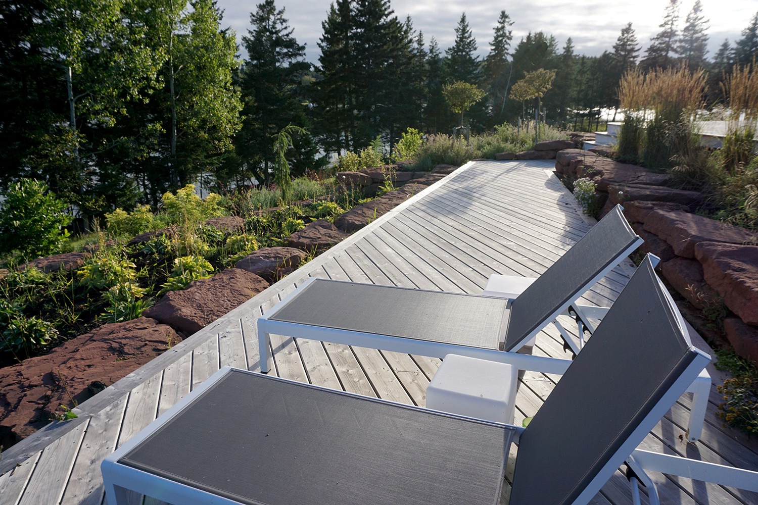 Wooden deck with chairs and garden view