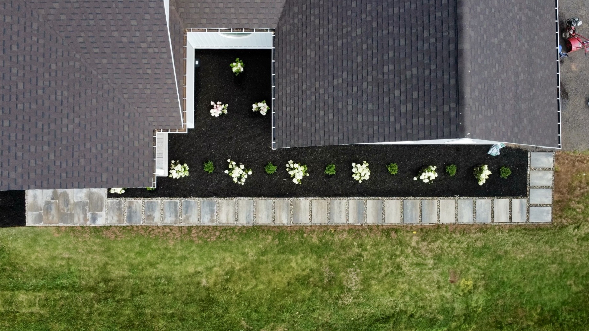 Aerial view of house with garden path and flowers.