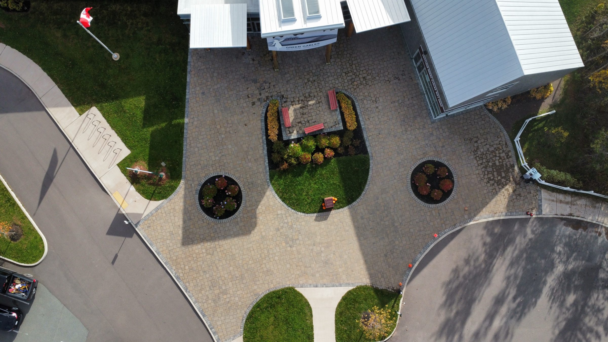 Aerial view of building entrance with Canadian flag.