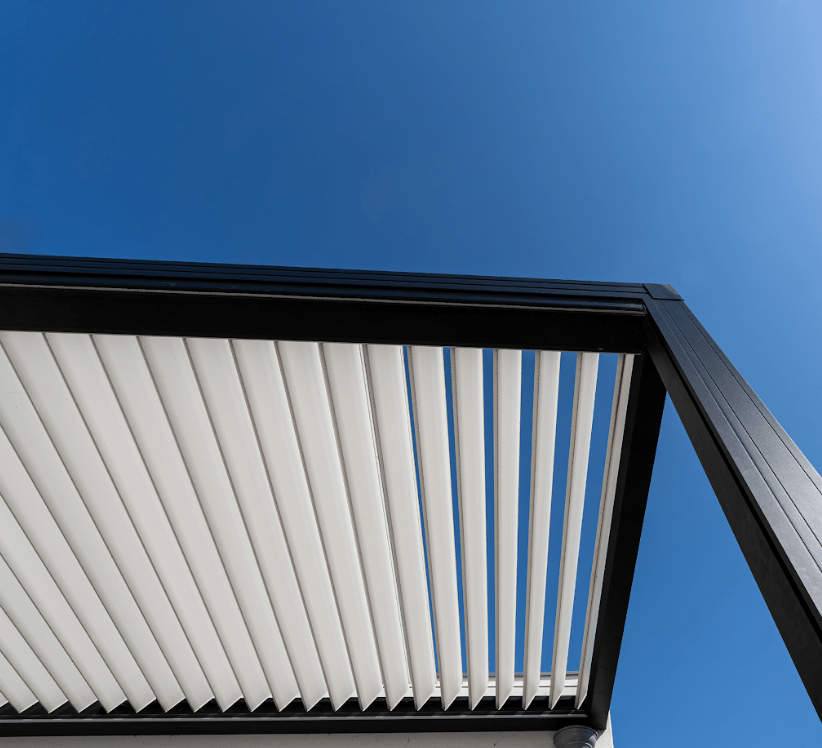 Modern pergola roof against clear blue sky