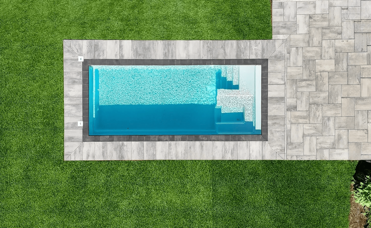 Aerial view of a rectangular swimming pool.